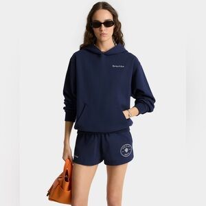 SPORTY & RICH X HOTEL EDEN ROC
Eden Crest Hoodie - Navy/White